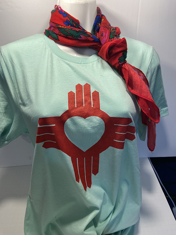 Teal t-shirt with red Zia Symbol heart